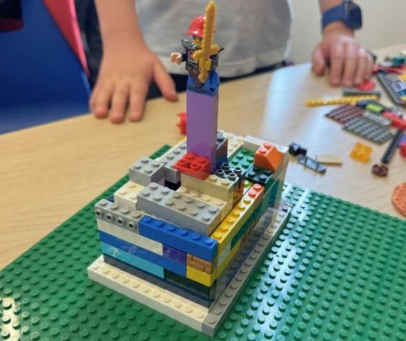 Children working through a LEGO engineering challenge